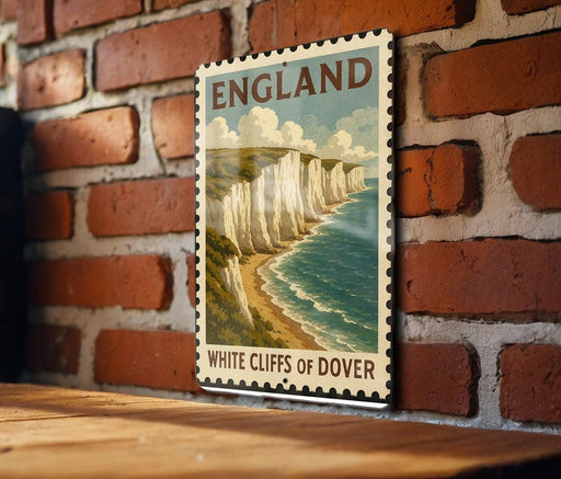 A vintage-style metal stamp depicting the White Cliffs of Dover, a famous coastal landmark in England.