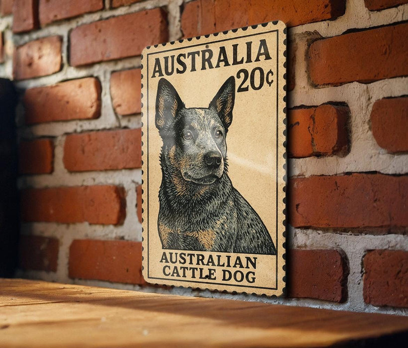 a wooden surface with a framed illustration of a black and tan Australian Cattle Dog on a brick wall.