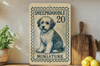 a wooden shelf with a framed illustration of a dog, a miniature postage stamp, and some kitchen utensils.