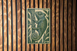 a chameleon, a type of lizard, on a wooden surface.