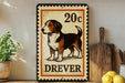 a 20c postage stamp with a dog illustration, placed on a wooden surface next to a wooden cutting board and some lemons.