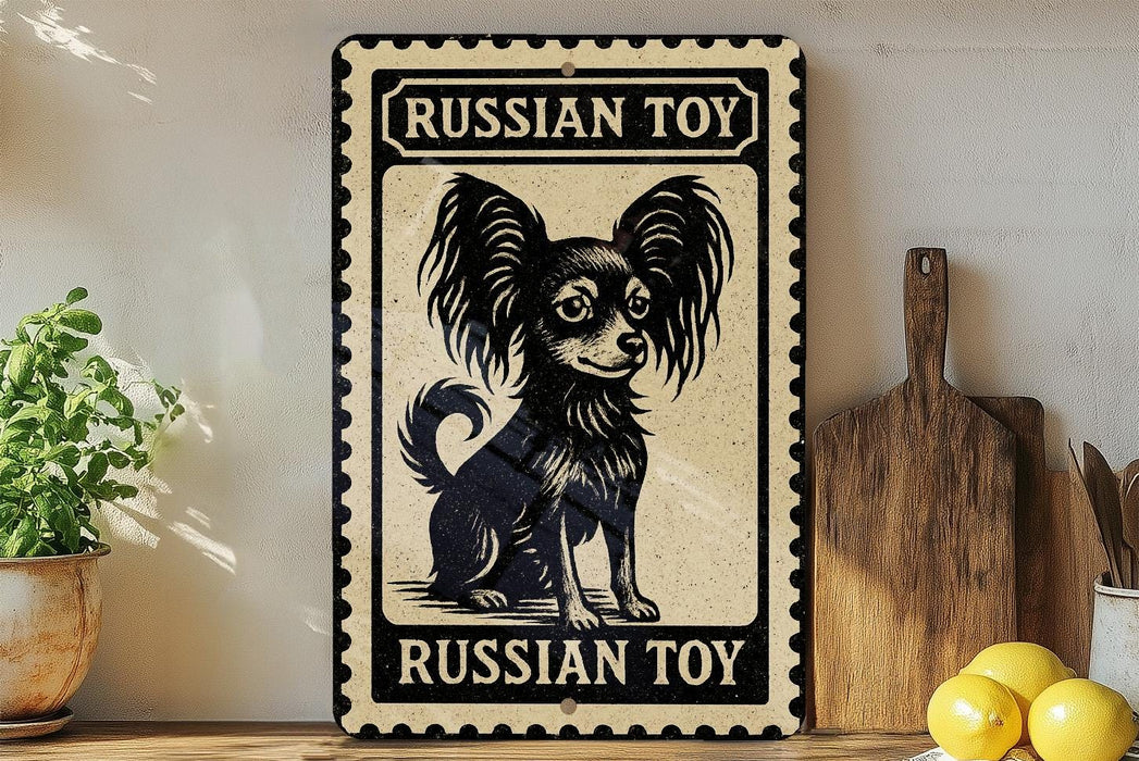A vintage-style metal sign with a black and white illustration of a Russian toy dog, placed on a wooden surface next to a wooden cutting board and some lemons.