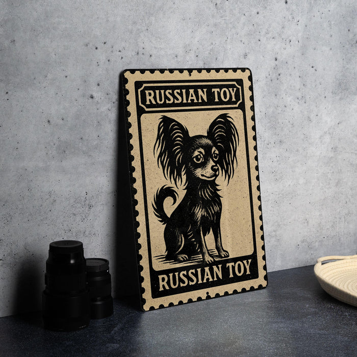 A metal sign with a black and white illustration of a Russian toy dog, sitting on a table.