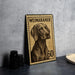 A metal stamp featuring a Weimaraner dog, with the number 60 printed on it, is displayed on a table.