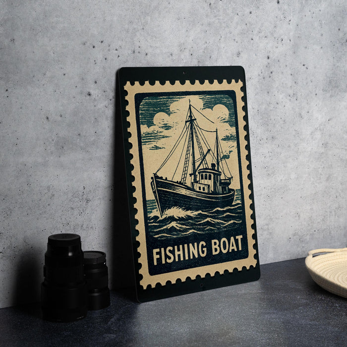 A framed image of a fishing boat is displayed on a table, accompanied by a stack of black camera lenses and a white dish.