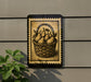 a decorative sign with a basket of pears on it, mounted on a wall.