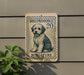 A sign featuring a dog illustration and the text "SHEPADOLE 20 MINIATURE" is displayed on a wall.