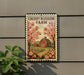 A sign for Cherry Blossom Farm, featuring a red barn and pink cherry blossoms against a backdrop of a rural landscape.