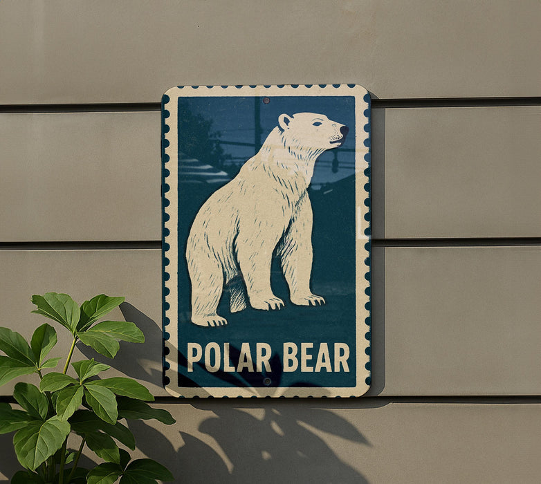 A polar bear illustration on a blue and white sign is mounted on a gray wall, with a plant visible to the left.