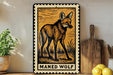 a framed illustration of a maned wolf, which is a type of wolf, displayed on a shelf next to a wooden cutting board and some lemons.