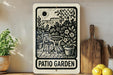 A sign that reads "PATIO GARDEN" is displayed on a wall, surrounded by various kitchen utensils and potted plants.