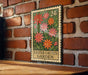 A metal sign with a floral design hangs on a brick wall, displaying the text "EASTER CACTUS GARDEN" and a denomination of 24 cents.