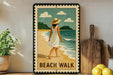 A framed illustration of a woman walking on a beach, with the text "BEACH WALK" below the image.