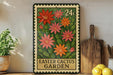 A metal sign with a floral design hangs on a wall, surrounded by potted plants and kitchen utensils.