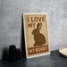 A metal sign with a cartoon rabbit and the text "I LOVE MY BUNNY" is displayed on a table.