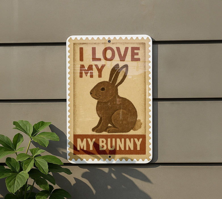 a sign with a picture of a rabbit and the text "I LOVE MY BUNNY" on a wall.