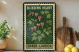 A vintage-style metal sign with a floral design and the text "BLEDING HEART SHADE GARDEN" is displayed on a shelf next to a wooden cutting board and a potted plant.