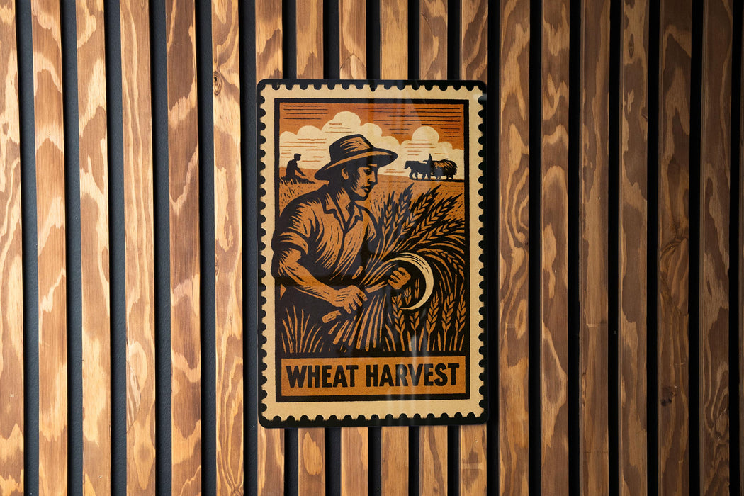A vintage-style wheat harvest poster is displayed on a wooden wall, featuring a farmer holding a scythe and a field of wheat.