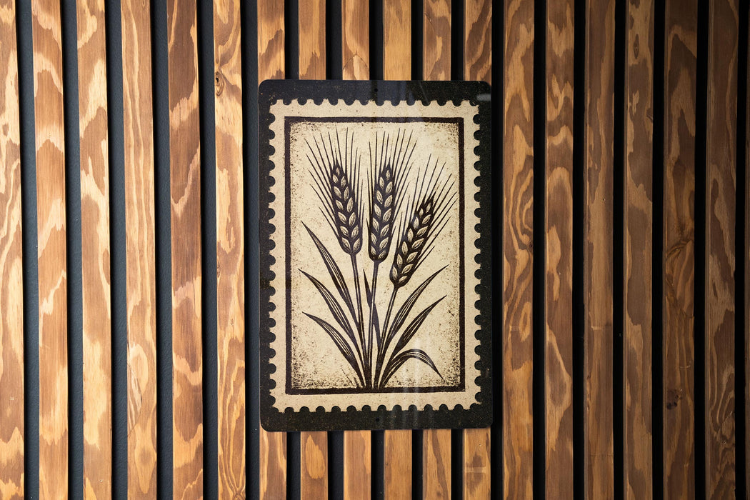 a wooden wall with a framed picture of wheat stalks.