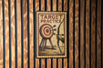 A vintage-style metal sign with the text "TARGET PRACTICE" and an illustration of a target with arrows.