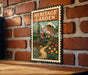 A vintage-style metal sign with a brick wall backdrop, featuring an illustration of a garden path and flowers.
