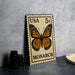 A US 5c postage stamp featuring a detailed illustration of a monarch butterfly.