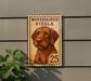 a wooden sign with a picture of a dog, mounted on a wall.