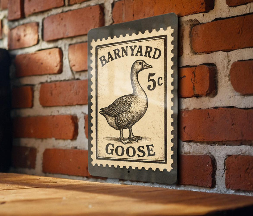 A metal sign with a black and white illustration of a goose and the text "Barnyard Goose" is mounted on a brick wall.