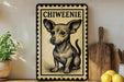 a decorative metal sign with a small dog illustration, placed on a wooden surface next to a potted plant and a wooden cutting board.