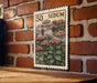 A 50 SEDUM postage stamp is displayed on a brick wall, featuring a detailed illustration of pink flowers and green leaves.