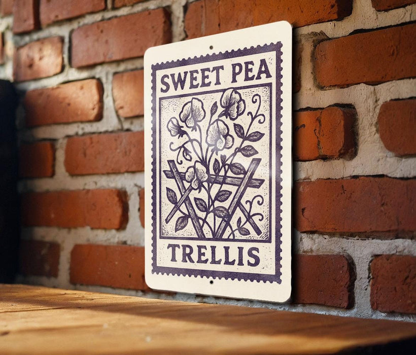 A sign with the text "Sweet Pea" and "Trellis" is displayed on a brick wall.