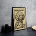 A metal stamp featuring a Dalmatian dog, with the text "DALMADO doodle 32" printed on it.