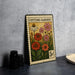 A metal stamp with a colorful illustration of flowers and plants, labeled "Cutting Garden", is displayed on a table.