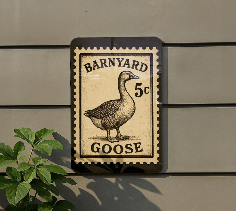 A sign featuring a goose on a postage stamp, mounted on a wall.