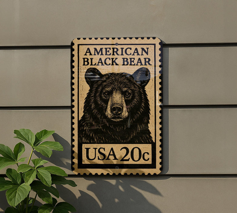 A wooden sign with a black bear image and text, mounted on a wall.