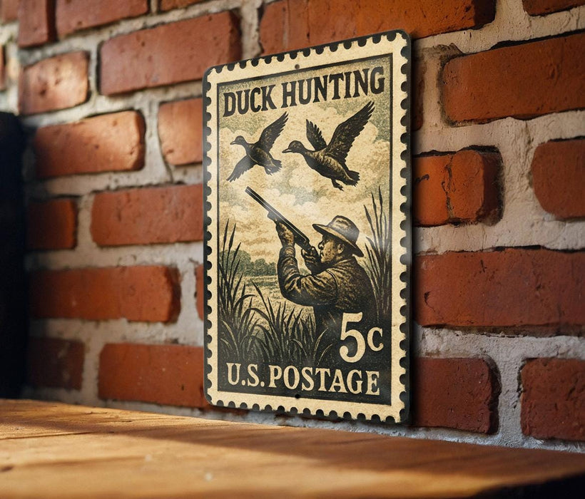 A vintage U.S. postage stamp featuring a duck hunting scene, mounted on a brick wall.