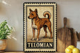 A metal sign with a drawing of a dog, labeled "TELOMIAN", is displayed on a shelf next to a wooden cutting board and some lemons.