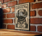 A black and white illustration of a Cocker Puff dog on a wooden surface, mounted on a brick wall.