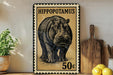 A vintage-style postage stamp featuring a hippopotamus, with the text "HIPPOPOTAMUS" and the denomination "50c". The stamp is displayed on a shelf next to a wooden cutting board and a potted plant.