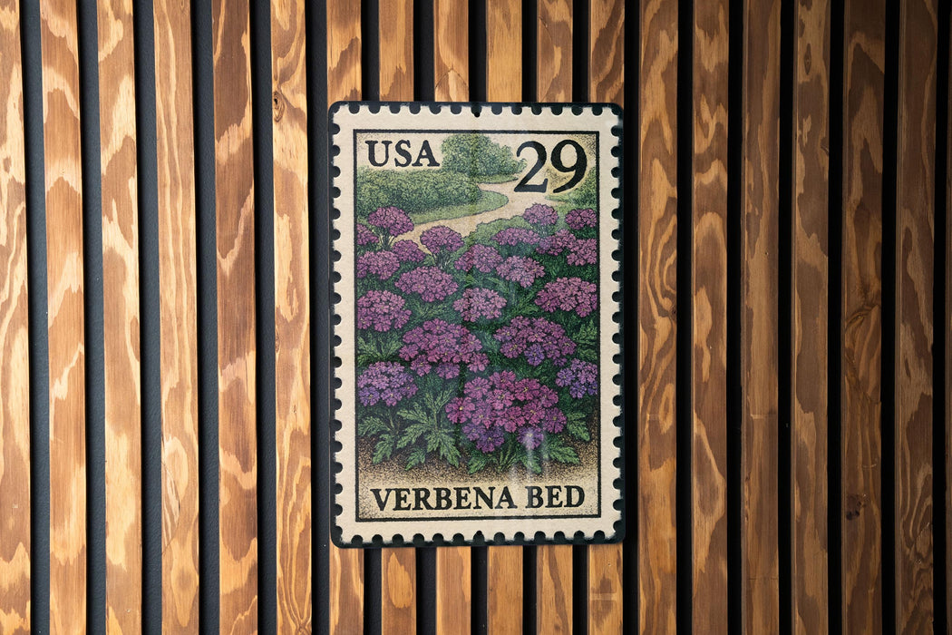 A USA 29 postage stamp featuring a field of purple flowers, with the text "VERBENA BED" printed on it.