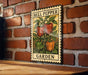 A vintage-style metal sign with a bell pepper illustration is mounted on a brick wall, displaying the text "BELL PEPPER GARDEN".