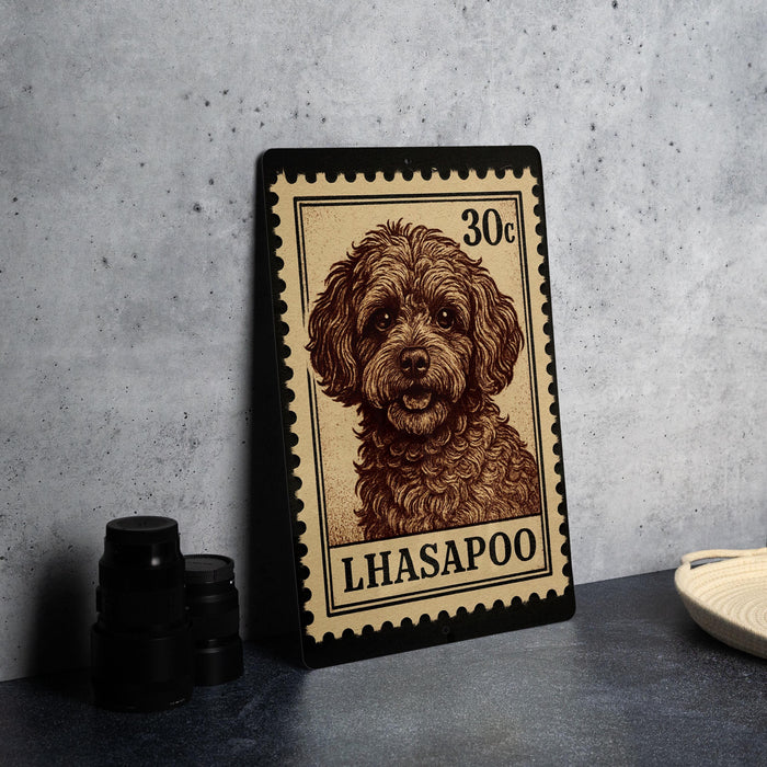 A metal stamp featuring a portrait of a dog, with the text "Lhasa poodle" printed on it.