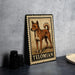 A framed illustration of a dog, specifically a Telomian breed, is displayed on a table.