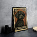 A 20-dollar U.S. postage stamp featuring a Schnauzer dog, placed on a table next to some black camera lenses.