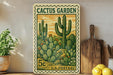 A vintage-style postage stamp featuring a cactus garden scene, with a 5c value, is displayed on a shelf next to a wooden cutting board and some potted plants.