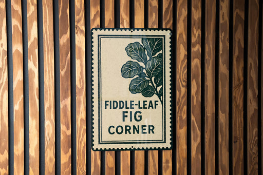 a sign with the text "Fiddle-leaf Fig Corner" on a wooden wall.