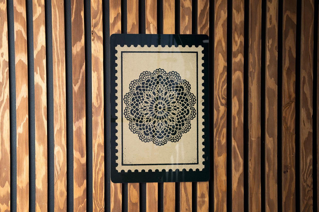 a decorative floral pattern on a wooden panel.