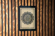 a decorative floral pattern on a wooden panel.