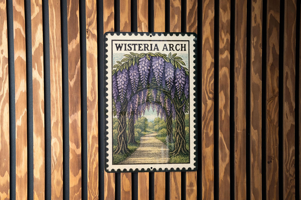 A framed image of a wisteria arch is displayed on a wooden wall.