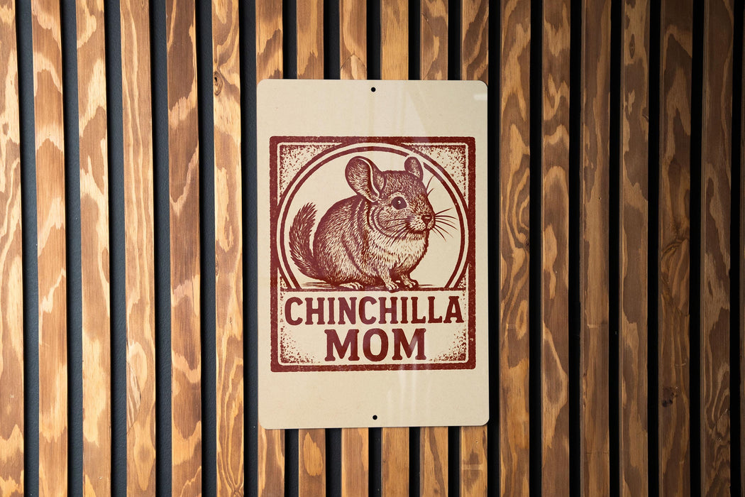 A sign with a chinchilla illustration and the text "CHINCHILLA MOM" is displayed on a wooden wall.